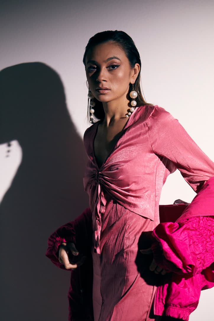 Julia Jones in a pink editorial look