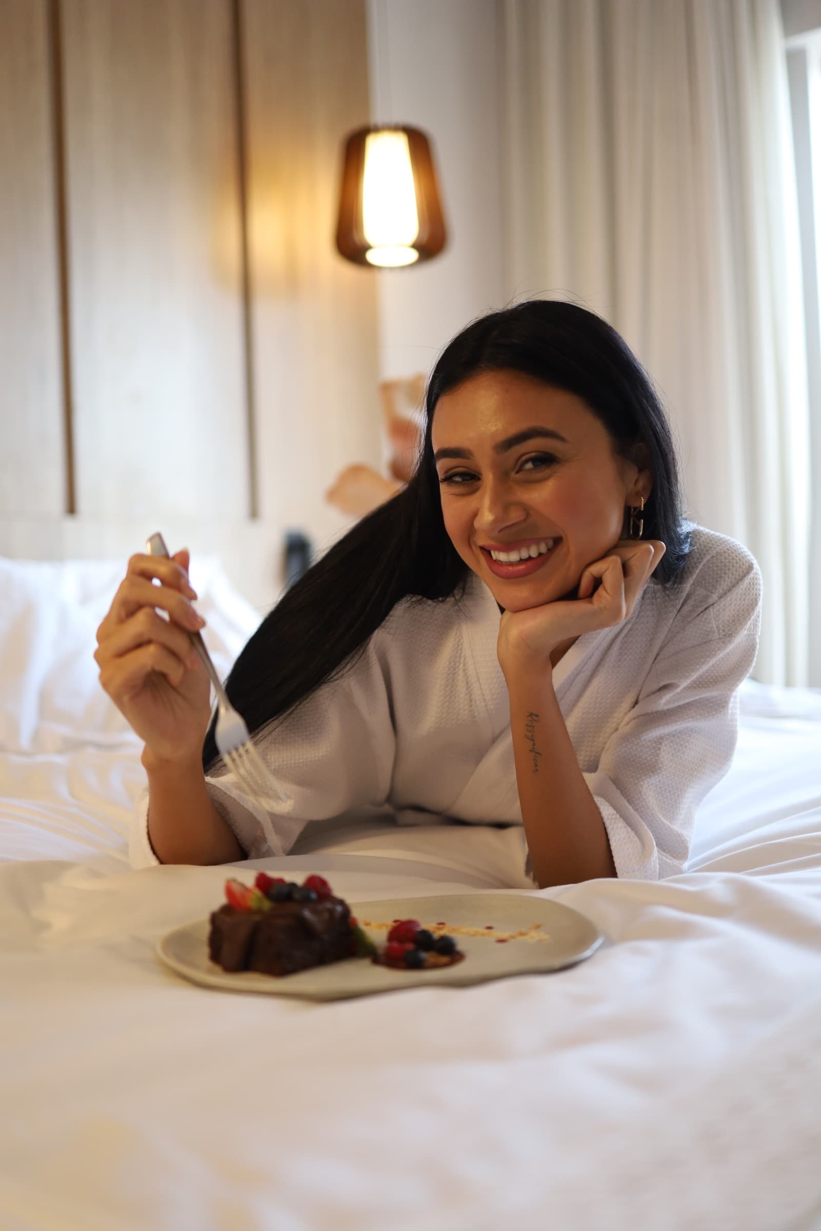 Julia Jones enjoying breakfast in bed during a Radisson stay campaign